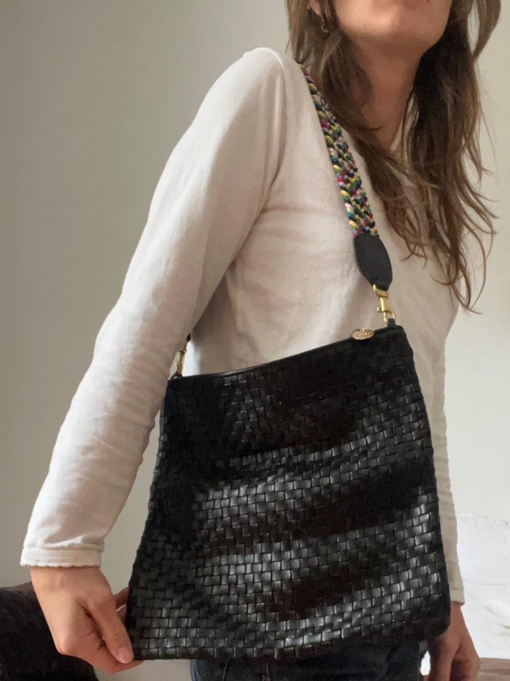 Claire V black woven leather clutch pouch bag with rainbow removable strap